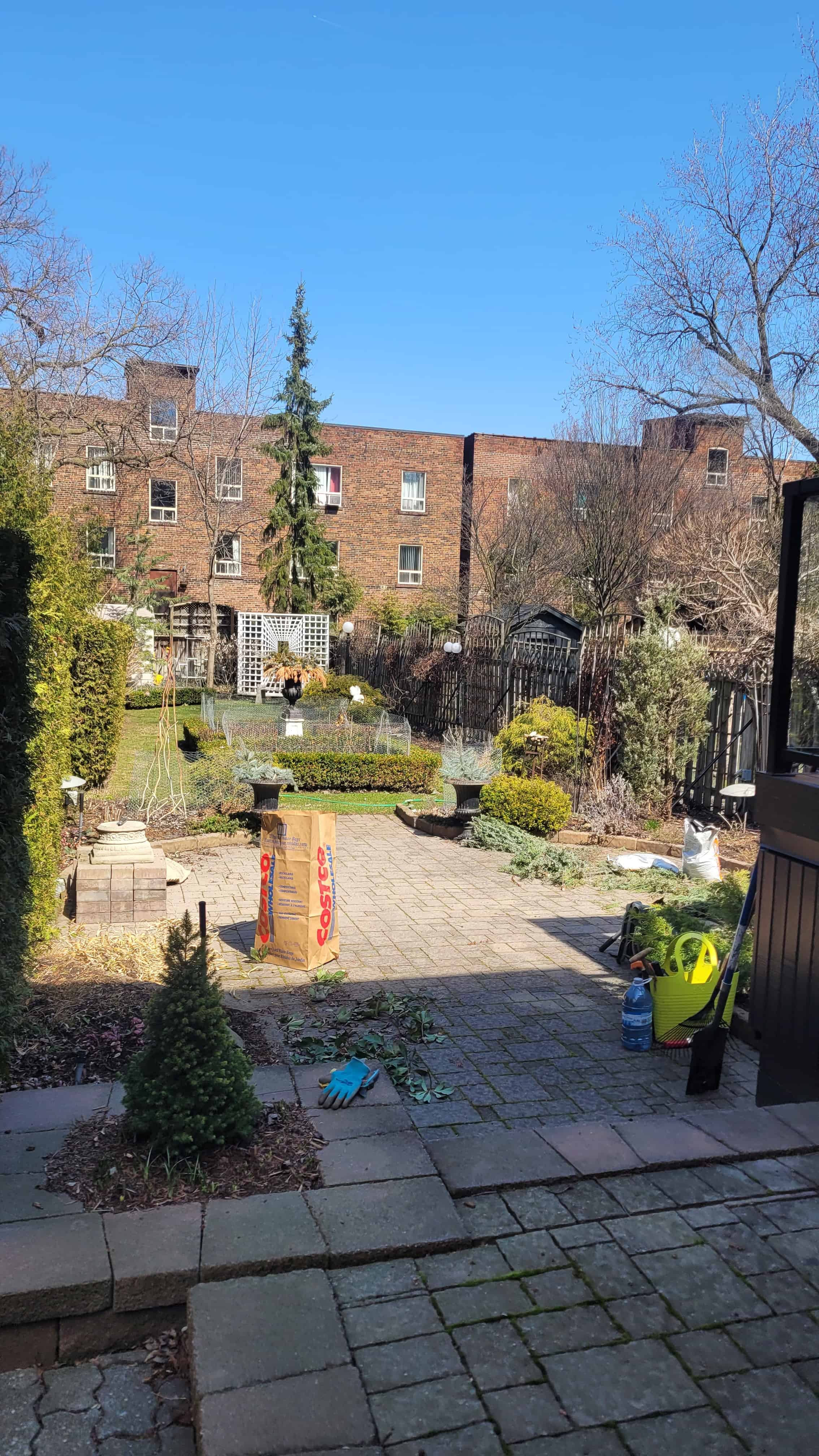 A cottage garden in winter, waiting for flowers to bloom and plants to grow.